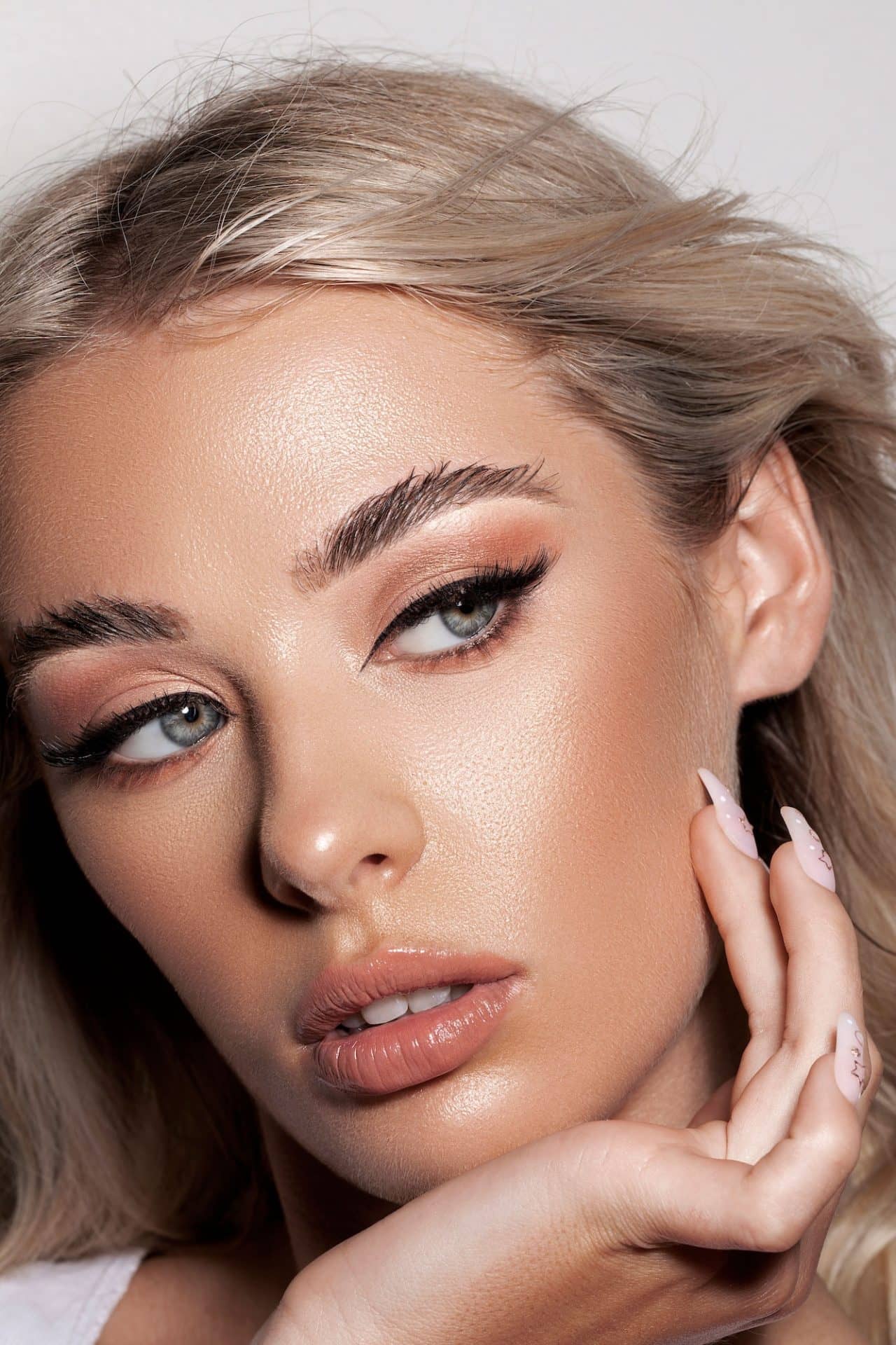 portrait of a caucasian professional female model with makeup e1683882709544